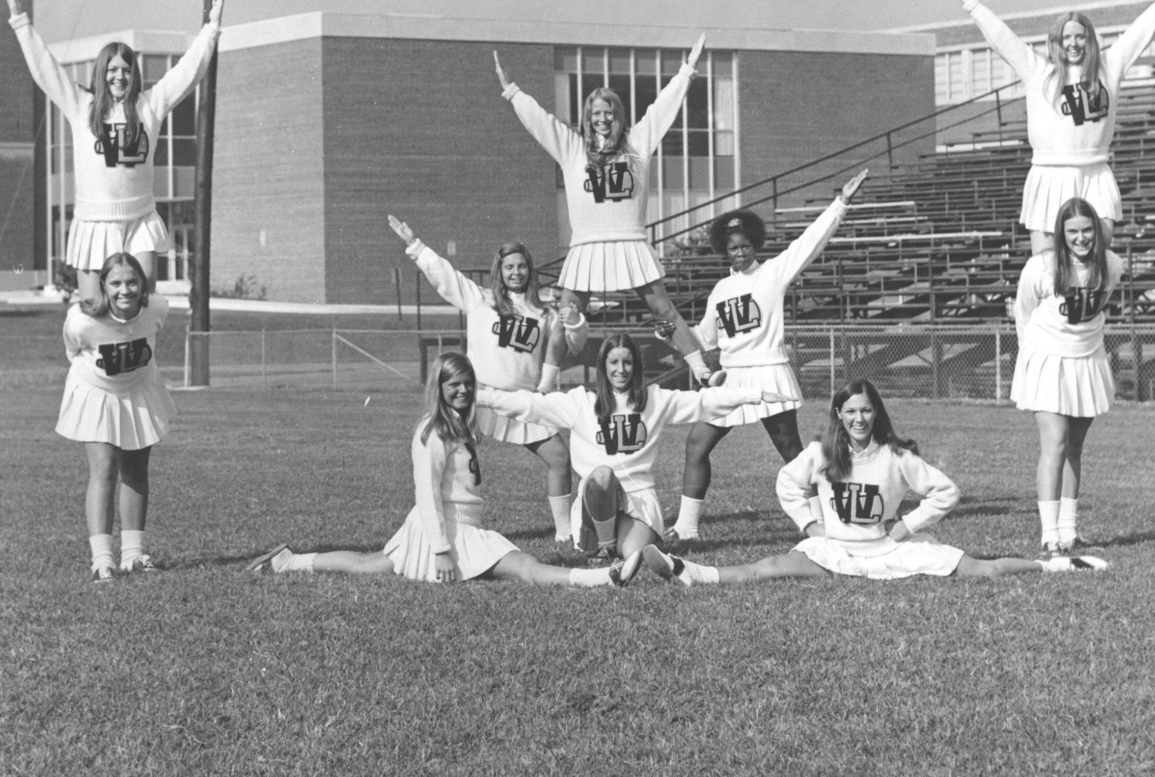The 1972 cheerleaders in front of the library addition.