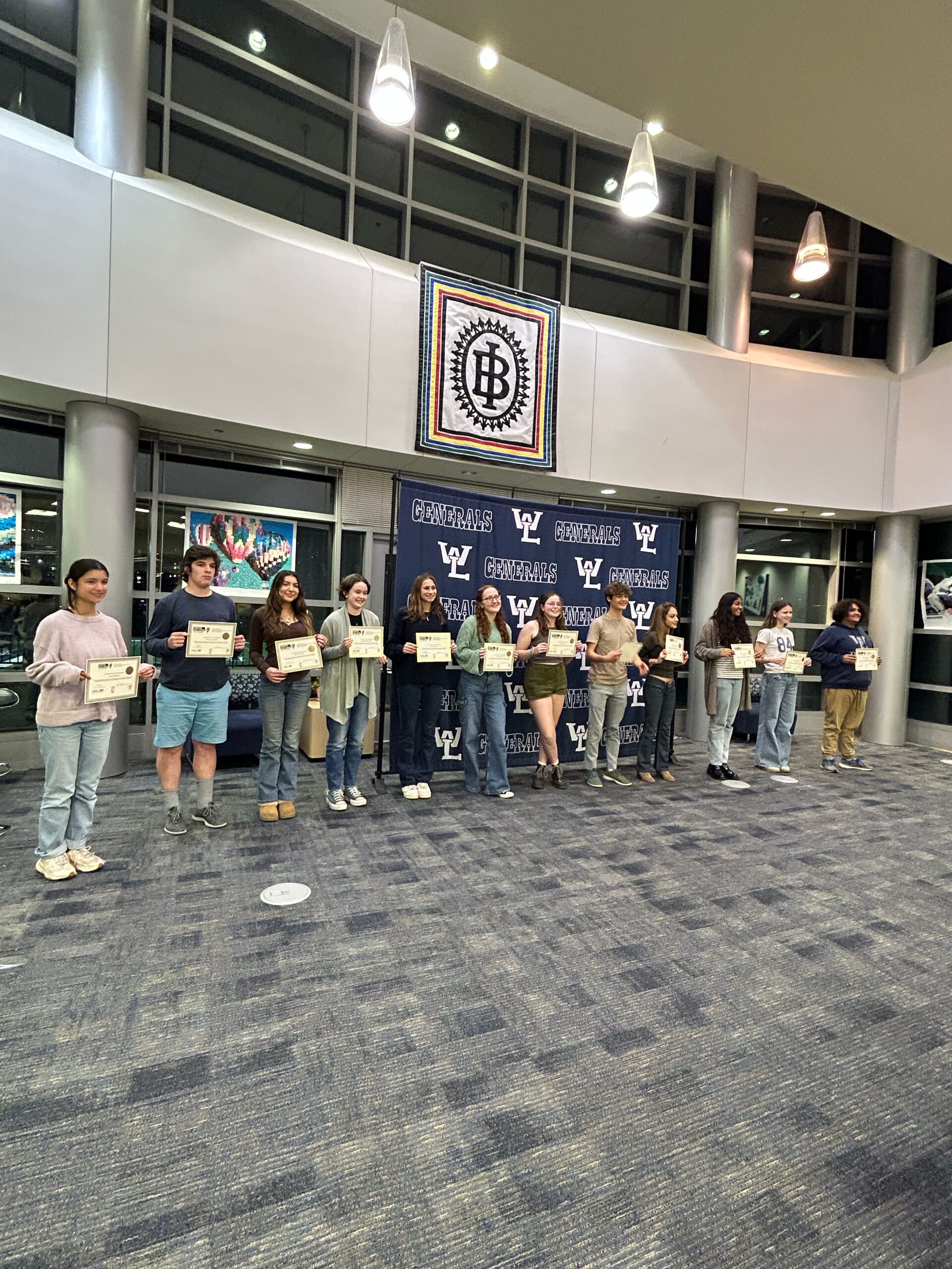 Twelve students with their Poetry Out Loud certificates