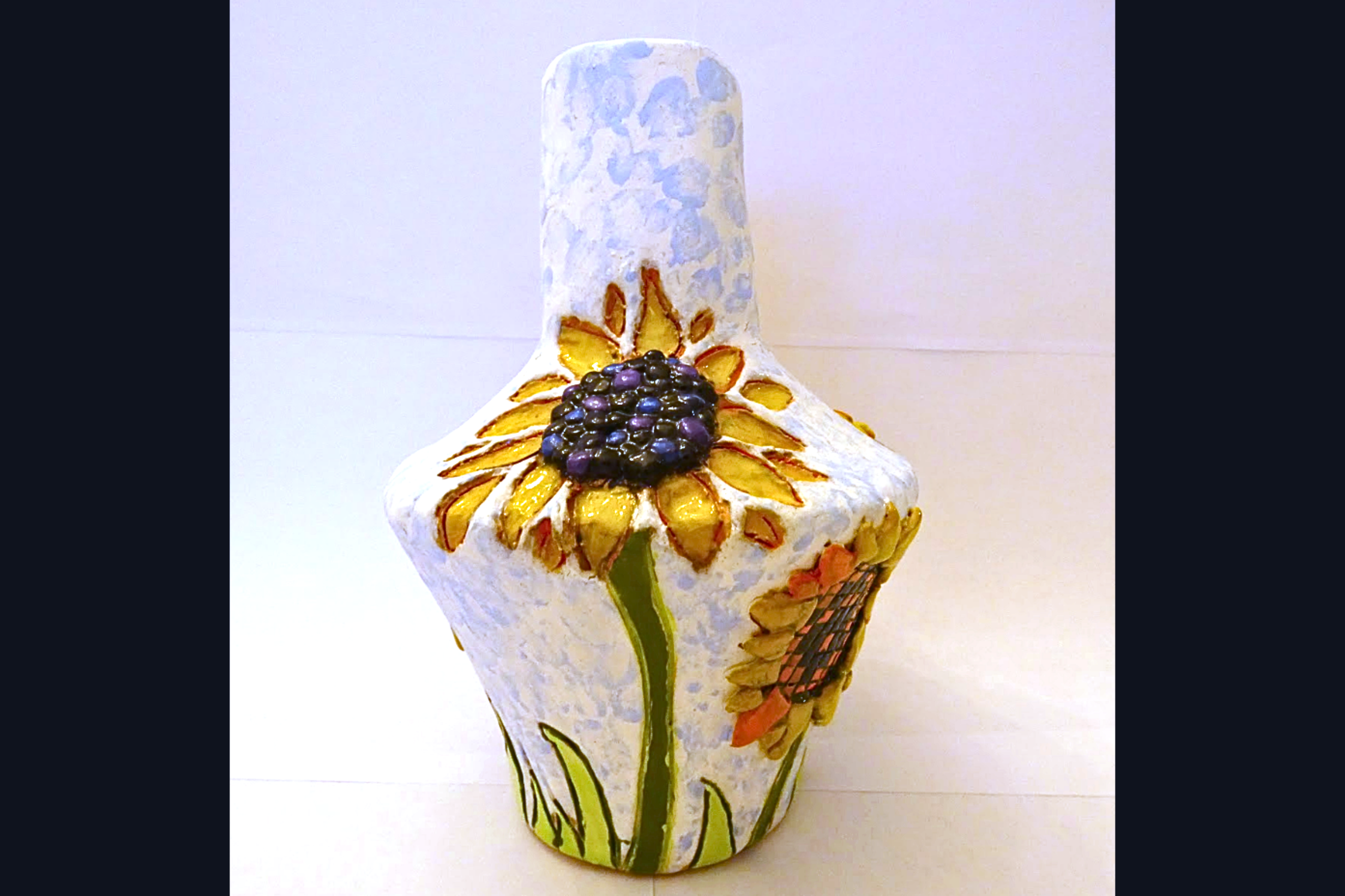 white vase with flower