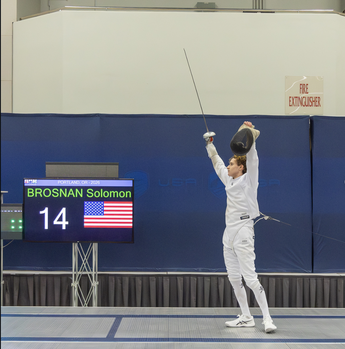 Fencer with arms raised